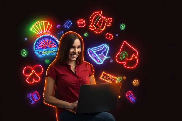 A woman smiling while playing online games on her laptop, surrounded by neon casino elements, showcasing KG999’s diverse game collection.